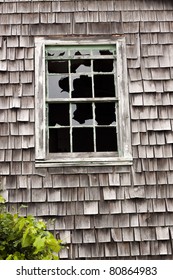 Old Retro Cedar Shake Style Abandoned Home With Broken Window