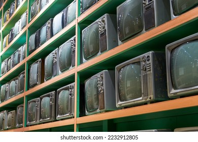 Old retro CRT TVs all over the wall
