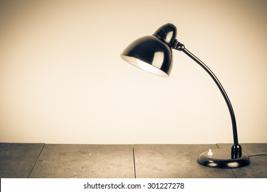 Old Retro Desk Lamp. Vintage Style Sepia Photo