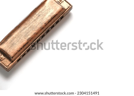 Old retro harmonica white background