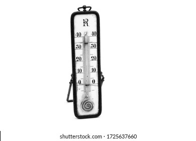 Old retro nostalgic thermometer Ancient thermometer which still uses liquid mercury. Metal stand thermometer. White background for and old piece of equipment. Antique piece of meteorology equipment