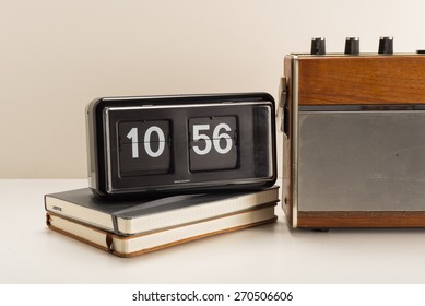 Old Retro Radio And Flip Clock With Journals With Vintage Effect