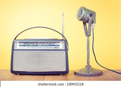 Old Retro Radio And Microphone Front Yellow Background