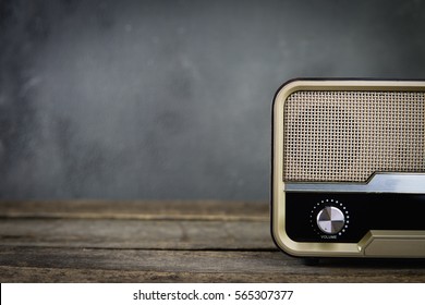Old retro radio with on table front gray background