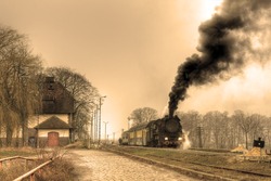Old Retro Steam Train Stopped At The Small Station