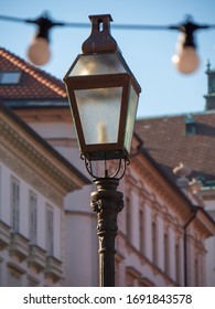 Old Retro Styled Street Lantern With Electric Lamp In The Ljubljana City. Metal Antique Streetlight For Urban Illumination In Vintage Design. Street Lantern Streetlight On A Post Closeup In Ljubljana.