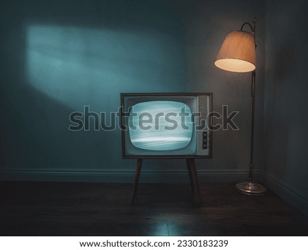 Old, retro tv in empty room at night with copy space