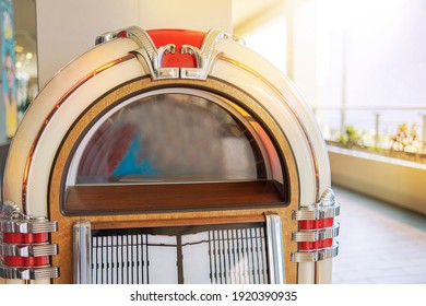 Old Retro Vintage Jukebox In A Diner Blasting Old Time Music Hits With Neon Lights, Rockola Vintage.