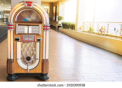 Old Retro Vintage Jukebox In A Diner Blasting Old Time Music Hits With Neon Lights, Rockola Vintage.