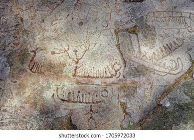 Old Rock Carving With Different Ancient Boat, Animals, Human Shape And Magic Phallus Motives From The Bronze Age