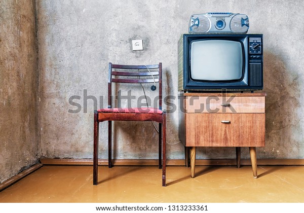 old room. retro\
tv, chair and cassette\
player