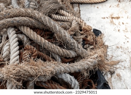 old rope, Rope tied knot Boat tools, Old damage rope texture stacked as background, Hard work of rope background.