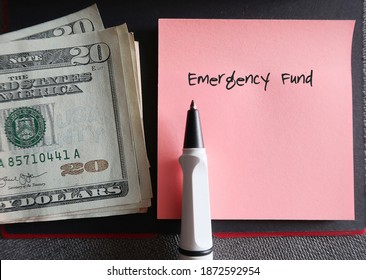 Old Rose Pink Note, A Pen And Cash Dollars Money With Text Written Emergency Fund , Concept Of Set Financial Goals To Save For Emergency Fund By Set Aside Small Saving