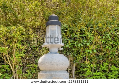 Old rotating beacon light once used in lighthouse.