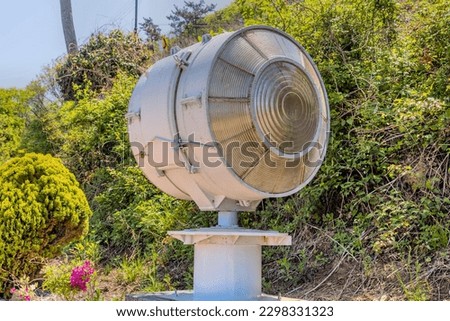 Old rotating beacon light once used in lighthouse.