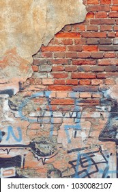 Old Rough Graffiti Grunge Colorful Brick Wall With Abstract Pattern, Vertical Background Or Texture. Old Red Urban Brickwall With Grafiti Street Art Elements And Details. Modern Street Art Concept