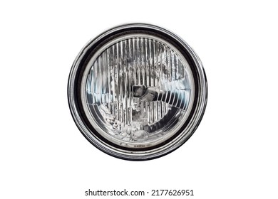 Old round headlight, an old-timer vehicle detail isolated on white background, close up