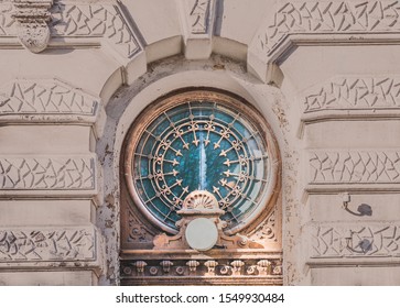 An old round window. Eclectic architecture .