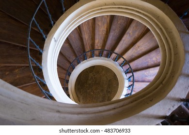 Old round wood stairway with handrails, top view
