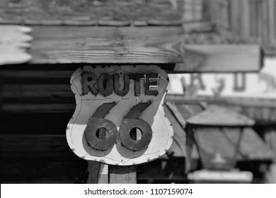 Old Route 66 Sign Posted Up Onto An Old Building In The Middle Of Nowhere. 