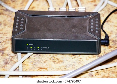 Old Router Network Hub With An Attached Patch Cable