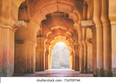 Old ruined arch of Lotus Mahal at sunset, Hampi, Karnataka, India.