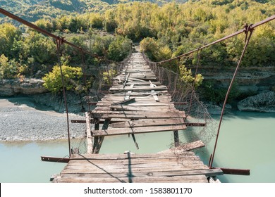 Old ruined foot bridge over the Vjose in Permet Albania. photographed in perspective 