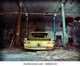 Old Ruined Garage Interior With Old Car