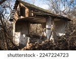 old ruined house, not suitable for living, fallen brick wall