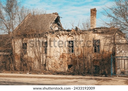 Old ruined house with rundown roof, selective focus
