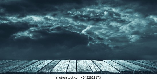 Old ruined wooden pier and dark cloudy sky, horror and darkness background - Powered by Shutterstock