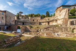 Old Ruins Of The Roman Theatre Or Amphitheater In Brescia Downtown Near The Capitolium Roman Temple (Tempio Capitolino), 1th Century AC, UNESCO World Heritage Site, Lombardy, Italy, Europe.
