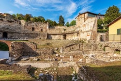 Old Ruins Of The Roman Theatre Or Amphitheater In Brescia Downtown Near The Capitolium Roman Temple (Tempio Capitolino), 1th Century AC, UNESCO World Heritage Site, Lombardy, Italy, Europe.