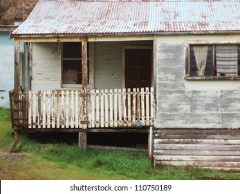 Old run down weatherboard houses in the mining town of Queenstown on the west coast of Tasmania