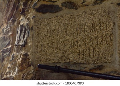 Old Runic Inscription Carved Into The Stone Wall