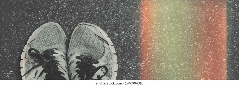 Old Running Sneakers On Pavement, Top View