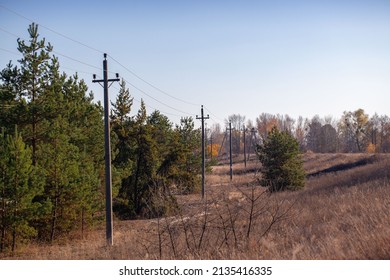Old rural electric lines pylon on blue sky background