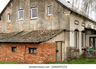 old rural German houses in the Kaliningrad region. inscription on the mailbox "for letters and newspapers" - Powered by Shutterstock