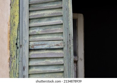 Old Rural House Window With Weathered Antique Green Wooden Shutters In Nafplio, Greece.