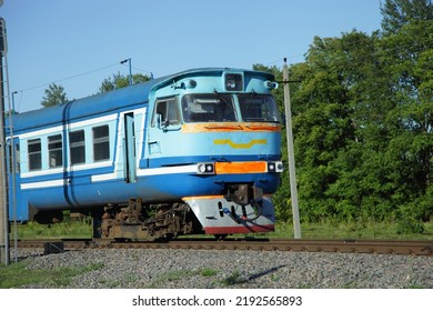 Old Russian Suburban Passenger Train On Countryside Forest Background Drive On One Way Railway At Summer Day