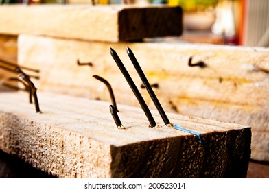 Old Rust Sharp Steel Nail in Carpentry Wood Plank in Carpentry Business and Carpenter Wood Work.