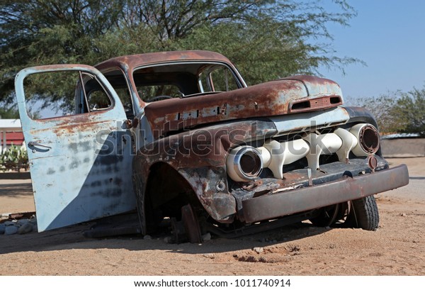 Old rusted car in the\
desert of Namibia