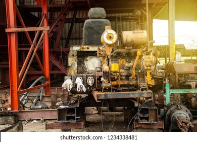 old rusted engine rear end of excavator or backhoe small in the garage repair. - Shutterstock ID 1234338481