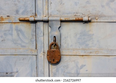 An Old And Rusted Lock On A Door