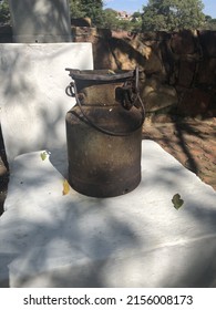 Old Rusted Milk Canister On A Stand