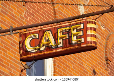 Old Rusted Neon Cafe Sign In Small Midwest Town.