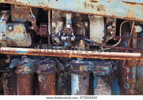 Old\
rusted steel details, farm tractor engine\
fragment