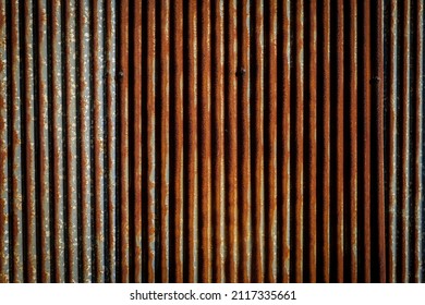 Old And Rusted Vertical Groove Galvanized Fence, Absract Background.