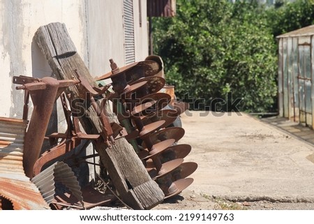 Old rustic agricultural equipment, rusty fixtures, farm