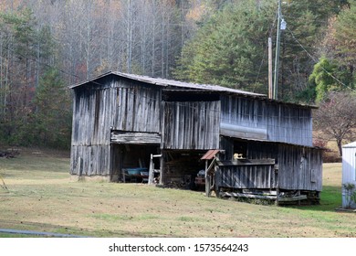an old rustic barn in the forest